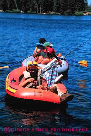 Stock Photo #2546: keywords -  boat child children family father fish fishing inflatable lake mother paddle parent raft recreation relax released summer together vacation vert water