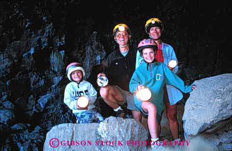 Stock Photo #2564: keywords -  adventure beds california cave caving child children dark explore family father flashlight girl helmet horz lantern lava light monument mother national parent recreation released safety team together