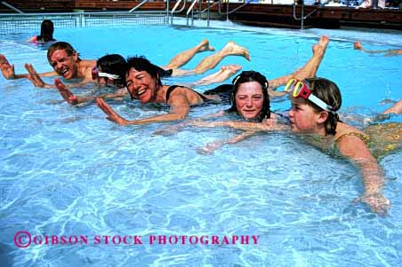 Stock Photo #2569: keywords - child children cruise daughter family father girl happy horz mother parent play pool recreation released ship smile summer swim together travel vacation warm water