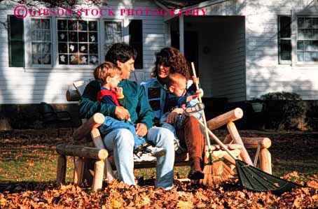 Stock Photo #2570: keywords - autumn boy break children fall family home horz house leaves outside parent rake released share son take together