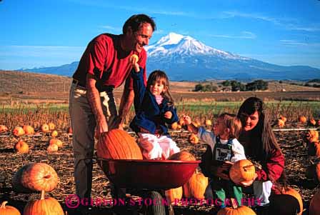 Stock Photo #2572: keywords -  assist autumn california children fall family girl halloween help horz mount outside parent pick pumpkin released share shasta together