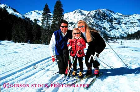 Stock Photo #2577: keywords -  child country cross family father fun girl horz mother nordic parent play portrait recreation released share ski snow sport together winter