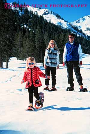 Stock Photo #2581: keywords -  child family father fun girl mother parent play recreation released share snow snowshoe sport together vert winter