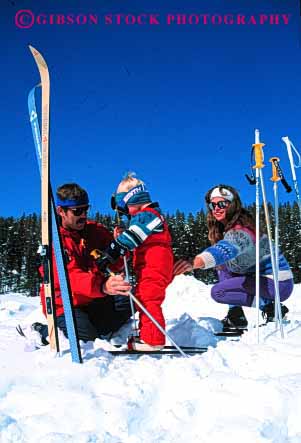 Stock Photo #2582: keywords -  boy child country cross family father fun mother nordic parent play recreation released share ski snow sport together vert winter