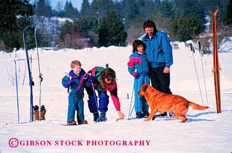 Stock Photo #2591: keywords - children country cross dog family father fun horz mother parent play recreation released share ski snow sport together winter