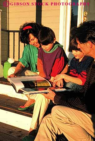 Stock Photo #2592: keywords - assist being book books boy boys calm chikldren child children close closeness education family father help home homes housae house kid kids learn leisure mother parent parents peaceful porch porches read reader readers reading reads relax relaxed relaxes relaxing released safety secure security share shared sharing son sons study summer teach together vert warm well