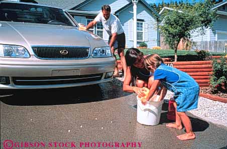 Stock Photo #3370: keywords -  car child clean cooperate families family father help home horz husband mother released security together wash wife