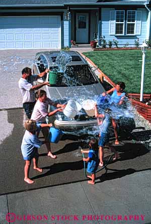 Stock Photo #2596: keywords -  auto bucket car children clean family fight fun home hose house parent play playing plays released residential soak splash splashes splashing summer throw throws together vehicle vert wash water wet