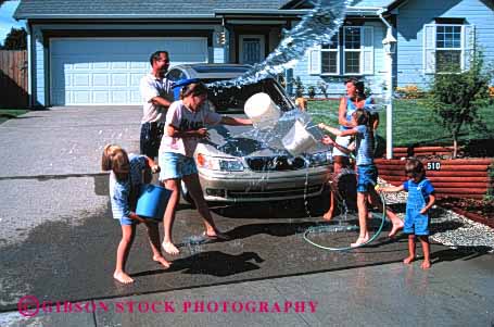 Stock Photo #2597: keywords -  auto bucket car children clean family fight fun home horz hose house parent play playing plays released residential soak splash splashes splashing summer throw throws together vehicle wash water wet