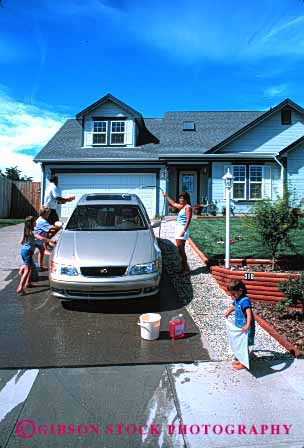 Stock Photo #2598: keywords -  auto bucket car children clean families family fun home hose house parent play released residential summer together vehicle vert wash water wet