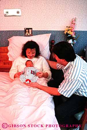 Stock Photo #2604: keywords -  affection baby bed birth child couple family father grow hospital infant love medical mother newborn parent pregnant released together vert young