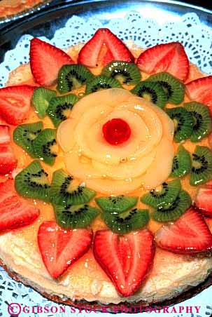Stock Photo #2623: keywords - bake baked bakery cake decorated dessert elegant fattening food fresh frosting fruit good goods item items kiwi pastries pastry round strawberry sweet sweets vert