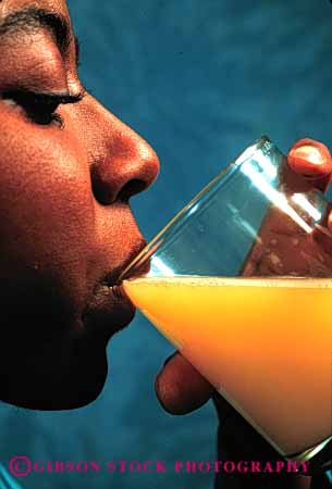 Stock Photo #2653: keywords -  african american beverage black drink ethnic female glass health juice minority nutrition orange refresh released vert woman