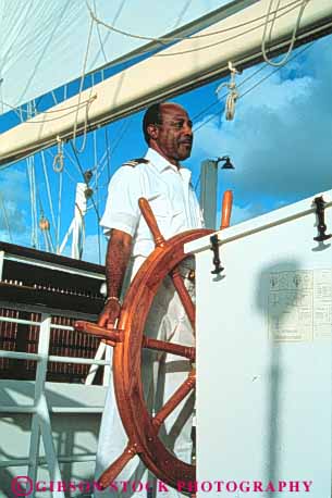 Stock Photo #3500: keywords -  african american black business busy captain career commerce control course craft crew duty earn educated employ employee employment flyer helm job labor man navigate occupactions occupation paid pay paycheck payroll professional released schooner seaman ship star steer task technical trade trained vert vocation wheel work worker