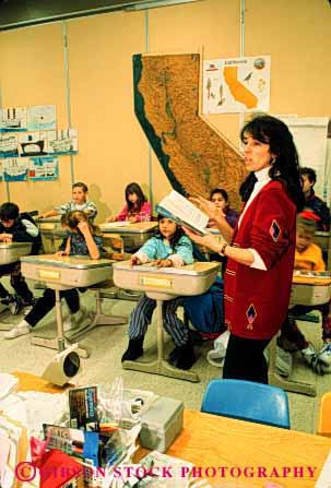 Stock Photo #2666: keywords - business career check class classroom education elementary employee group income job leader learn occupation pay profession released skill students teacher teaching vert vocation woman work