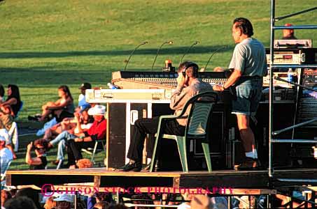 Stock Photo #2670: keywords -  amplify audio board boards business california career check concert concerts control electric electronic employee engineer engineers equipment horz income job jobs man men mount music noise not occupation outdoor outdoors outside pay people performance person profession released shasta show skill sound technician technicians vocation volume work