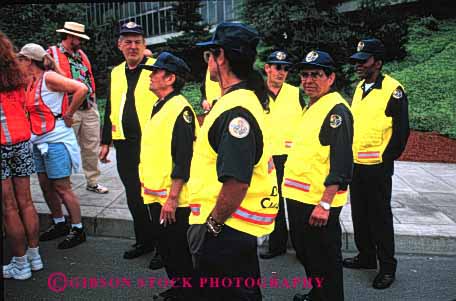 Stock Photo #2672: keywords -  business career check employee ethnic event group horz income job not occupation pay profession skill staff team uniform vest vocation work yellow