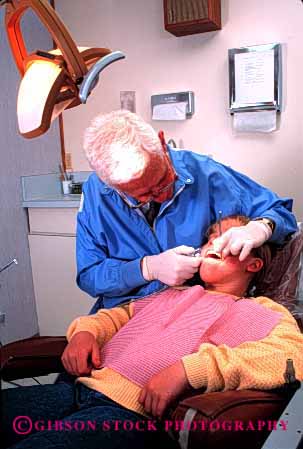 Stock Photo #2686: keywords -  business care career check dental dentist girl income job labor medical mouth occupation patient pay profession released skill technician teeth vert vocation work
