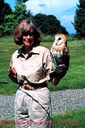 Stock Photo #2688: keywords -  animal arm bird birds business captive captivity care career check employee handler hold holding holds income job jobs labor not occupation owl owls park pay people person profession seattle showing shows skill technician vert vocation washington wildlife woman woodland work worker working zoo zoos