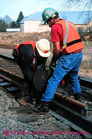 Stock Photo #2689: keywords -  business career check cooperate cut employee hardhat heavy income industry job labor maintenance men metal not occupation pay power profession rail railroad released safety saw skill team technician tool track transportation vert vest vocation work