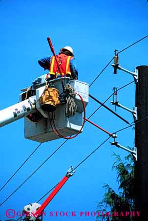 Stock Photo #2696: keywords -  bucket business career careful caution check danger electric electrical employee grid hardhat income industry job labor lift line man not occupation pay pole power profession released repair risk safety shock skill technician utility vert vest vocation work