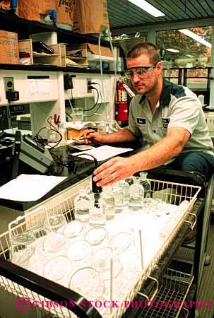 Stock Photo #2698: keywords -  business career check chemistry clean employee income industry job labor laboratory man monitor occupation pay plant profession quality released skill technician test treatment vert vocation water work