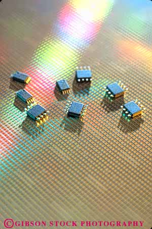 Stock Photo #11082: keywords -  chip chips closeup communications component computer computers computing detail disk equipment high industry little micro modern new part parts row semiconductor semiconductors silicon small technology tiny vert wafer