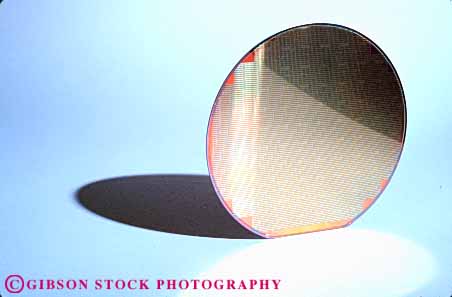 Stock Photo #11087: keywords -  circle circular communications component computer computers computing disk equipment high horz industry modern new part parts round semiconductors shadow shadows shape shapes silicon technology wafer
