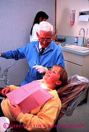 Stock Photo #2729: keywords -  adolescent care career child citizen dental dentist dentistry doctor examine girl gray hair job laugh man medical mouth occupation patient profession released senior skill teeth training vert vocation work