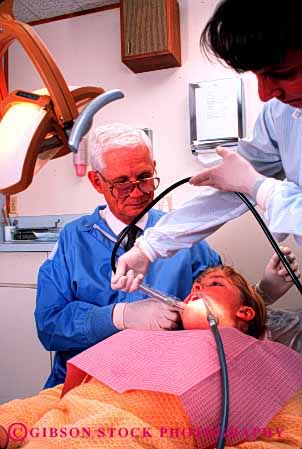 Stock Photo #2730: keywords -  adolescent assist care career child citizen cooperate dental dentist dentistry doctor examine filling girl hygienist job man medical mouth occupation patient profession released senior set skill team teeth training vert vocation work