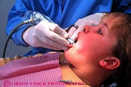 Stock Photo #2731: keywords -  adolescent care career child citizen dental dentist dentistry doctor examine girl horz job medical mouth occupation patient profession released skill teeth training vocation work