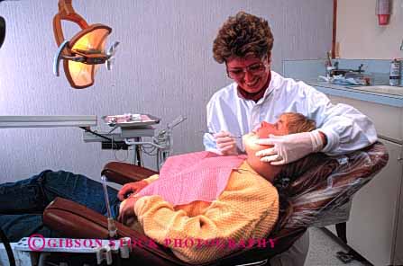 Stock Photo #2732: keywords -  adolescent care career child citizen dental dentist dentistry doctor examine girl horz hygienist job medical mouth occupation patient profession released skill teeth training vocation woman work