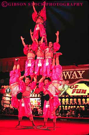 Stock Photo #2734: keywords - acrobat acrobatic acrobatics acrobats balance balanced balances balancing circus cooperate cooperation coordinate coordinated coordination group human las lift men nevada not people perform person practice pyramid released skill skilled skills strength strong tall teamwork vegas vert