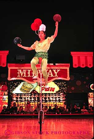 Stock Photo #2736: keywords -  acrobat balance circus coordinate coordination las nevada not perform practice released ride skill strength unicycle vegas vert wheel woman