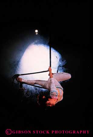Stock Photo #2737: keywords - acrobat balance circus coordinate coordination daring hang las nevada not perform practice released risk skill strength student swing trapeze vegas vert woman