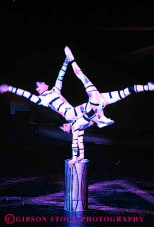 Stock Photo #2738: keywords -  acrobat acrobatic acrobatics acrobats balance balanced balances balancing casino cooperate cooperation coordinate coordinated coordination group las lift luxor men nevada not people perform person practice released skill skilled skills strength teamwork vegas vert