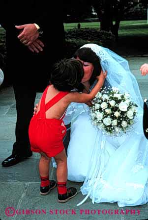 Stock Photo #2756: keywords - affection boy bride celebrate child commitment cute family groom kiss kissing love marriage released share together vert vow wedding wife woman