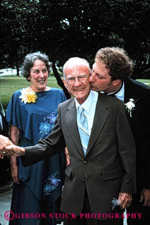 Stock Photo #2757: keywords - affection bride celebrate commitment family generations grandfather grandson groom husband love man marriage relatives released senior share together vert vow wedding wife woman
