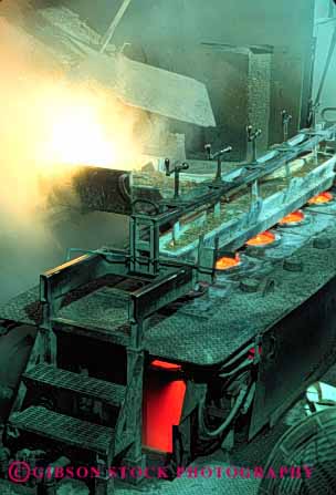 Stock Photo #2767: keywords -  brass burn danger equipment foundry heat hot in industry machine manufacture melt metal molten pour risk safety technology vert