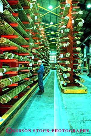 Stock Photo #2770: keywords -  bar brass checks equipment foundry in industry inventory job machine man manufacture metal occupation product rack released stack technology vert warehouse