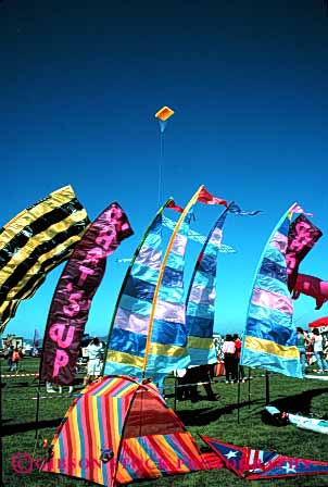 Stock Photo #2795: keywords - aerodynamic aerodynamics air banners blow color colorful colors design engineer festival flight fly flying geometric geometrical geometry kite lift lifted lifts lightweight material row rows sky soar string style synthetic vert wind
