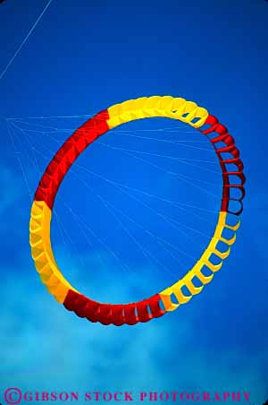 Stock Photo #6121: keywords - aerodynamic aerodynamics air circle color colorful design drift drifting flight float floating fly flying hang kite lighter miami red rotate rotating round sky symmetrical symmetry tether tethered than turn turning vert weightless wind yellow
