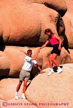 Stock Photo #2803: keywords -  affection assist california careful caution couple desert fun hand help hike hold husband intimate joshua national outdoor park play recreation released rock share summer together tree vert wife