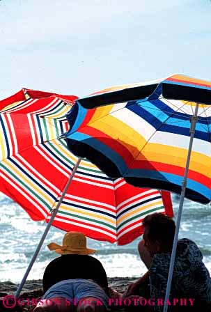 Stock Photo #2813: keywords -  affection beach coast couple fun husband intimate not ocean outdoor play recreation released shade share summer sun sunshine together umbrella under vert wife