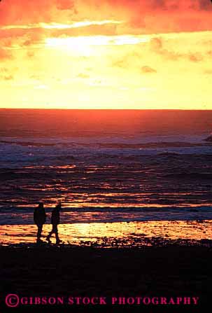 Stock Photo #2817: keywords -  alone beach calm couple dusk intimate love ocean orange peaceful quiet romantic share silhouette solitude summer sunset together vacation vert warm washington water yellow