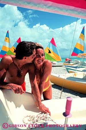 Stock Photo #2819: keywords - affection beach calm couple fun honeymoon husband intimate kiss love ocean play private released share smile solitude summer sun sunshine swim tan together travel vacation vert water wife