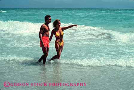 Stock Photo #2820: keywords -  affection beach calm couple florida fun hand hold honeymoon horz husband intimate love ocean play private released share solitude stroll summer sun sunshine surf swim tan together travel vacation wade walk water wife