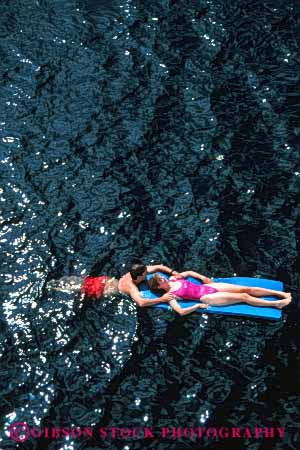 Stock Photo #2822: keywords - affection calm couple float fun honeymoon husband intimate love mat ocean play private relax released share solitude summer sun sunshine swim tan together travel vacation vert water wife
