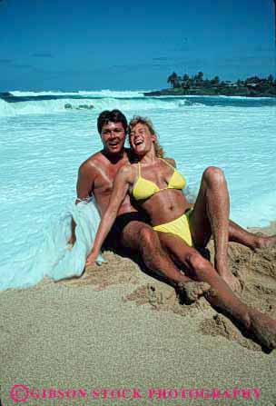 Stock Photo #2826: keywords - affection beach calm couple fun honeymoon husband intimate love ocean play private released sand share sit smile solitude splash summer sun sunshine surf surprise swim tan together travel vacation vert water wave wife
