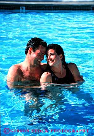 Stock Photo #2829: keywords -  affection alone couple fun hug husband intimate play pool private released share snuggle solitude summer sun sunshine swim together travel vert water wife